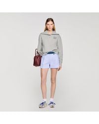 Sandro - Embroidered Split Neck Sweatshirt - Lyst