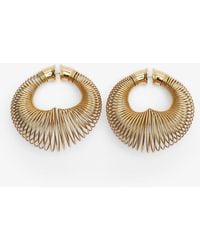 Alaïa - Spiral Hoops Gold Earrings - Lyst