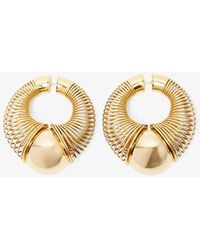 Alaïa - Spiral Gold Small Hoop Earrings - Lyst