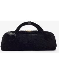 Alaïa - Le Teckel Black Shearling Clutch - Lyst