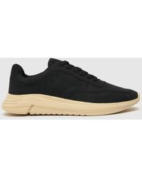 schuh black trainers
