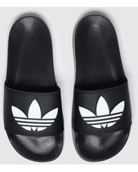 adidas - Ladies Black And White Adilette Lite Sandals - Lyst