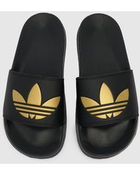 buy adidas flip flops