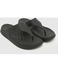 Crocs™ - Getaway Triangle Flip Sandals - Lyst