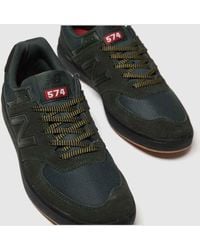 black & green 574 trainers