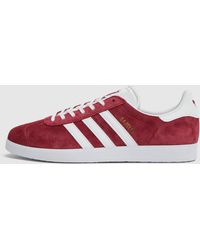 red and black adidas gazelle