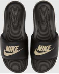 black nike slippers
