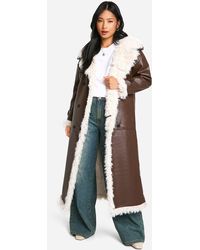 Boohoo - Petite Faux Leather Longline Coat - Lyst