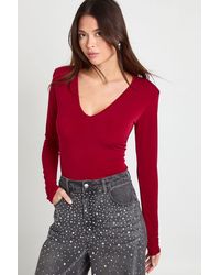 Boohoo - Slinky Plunge Front Long Sleeve Shoulder Pad Bodysuit - Lyst