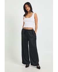 Boohoo - Petite Satin Elasticated Waist Wide Leg Trouser - Lyst