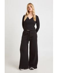Boohoo - Petite Wrap Front Long Sleeve Top And Straight Leg Jogger Tracksuit - Lyst