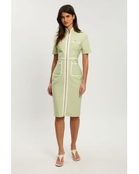 Karen Millen - Petite Figure Form Bandage Knit Piping Detail Short Sleeve Military Midi Dress - Lyst