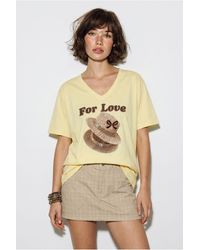 Bianco Lucci - Oversized V-Neck Printed T-Shirt - Lyst