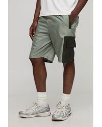 BoohooMAN - Elasticated Waist Relaxed Mid Length Nylon Cargo Shorts - Lyst