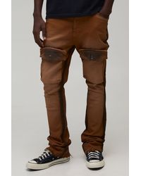 BoohooMAN - Skinny Stack Flare Multi Pocket Distressed Spray Wash Cargo Trousers - Lyst