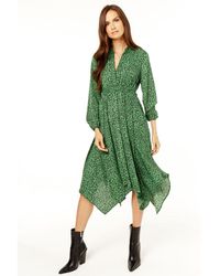 Gini London - Groene Midi-jurk Met Lange Mouwen En Asymmetrische Zoom - Lyst
