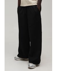 BoohooMAN - Extreme Wide Leg Exposed Seam Toggle Hem Jogger - Lyst
