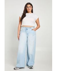 Boohoo - Plus High Waist Crossover Waistband Wide Leg Jean - Lyst