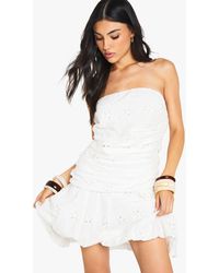 Boohoo - Ruched Bandeau Dropped Waist Broiderie Mini Dress - Lyst
