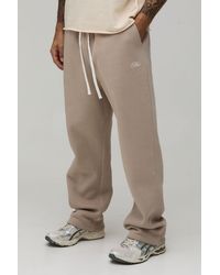 BoohooMAN - Baggy Fit Script Embroidered Joggers - Lyst