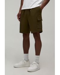 BoohooMAN - Relaxed Fit Elasticated Technical Stretch Cargo Shorts - Lyst