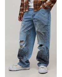 BoohooMAN - Dirty Wash Ripped Knee Relaxed Fit Jeans - Lyst