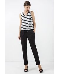 Conquista - Lange Zwarte Broek Met Strikdetail In Zwart - Lyst