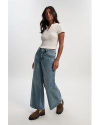 Boohoo - Petite Mid Waist Y2K Wide Leg Jean - Lyst