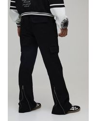 BoohooMAN - Elasticated Waist Zip Hem Flared Cargo Trousers - Lyst