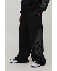 BoohooMAN - Extreme Wide Leg Dragon Graphic Joggers - Lyst
