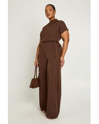 Boohoo - Plus Asymmetric Belted Jumpsuit - Lyst