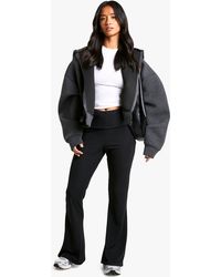 Boohoo - Petite Fold Over Waistband Soft Rib Flare Trouser - Lyst