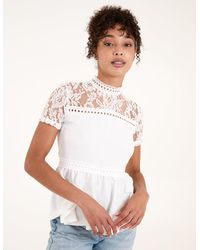 Blue Vanilla - Lace Trimmed Peplum Top - Lyst