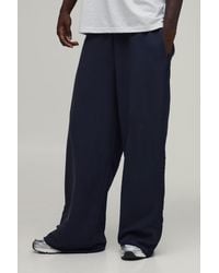 BoohooMAN - Extreme Wide Leg Loopback Embroidered Raw Hem Joggers - Lyst