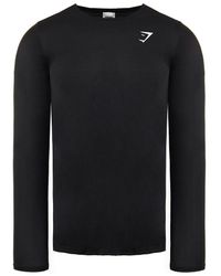 GYMSHARK - Lange Mouw Crew Hals Zwart Vital Top - Lyst