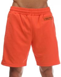 Heron Preston - Short Logo Track Shorts In Oranje - Lyst