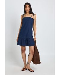 Boohoo - Tall Strappy Dropped Hem Denim Mini Dress - Lyst