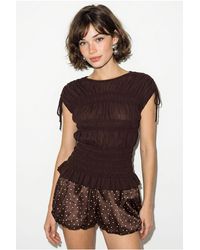 Bianco Lucci - Fitted Sleeveless Knit Blouse With Tie Detail - Lyst