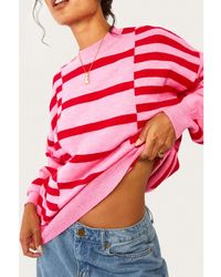 Azura Exchange - Roze Gestreepte Mouwen Met Bellen Drop Shoulder Geribde Rand Trui - Lyst