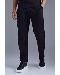 BoohooMAN - Elasticated Waist Tapered Fit Pleated Trouser - Lyst