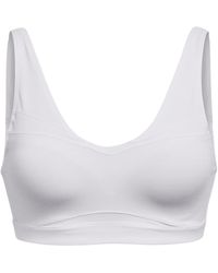 Under Armour - Smartform Evolution Mid Medium Impact Sports Bra - Lyst