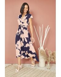 Mela London - Blossom Print Wrap Midi With Dipped Hem - Lyst