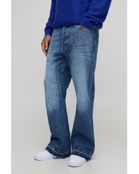 BoohooMAN - Tall Gusset Let Down Hem Flared Jeans - Lyst