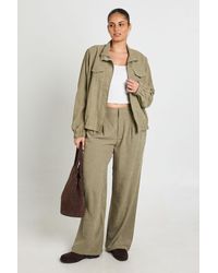 Boohoo - Plus Peached Pleated Wide Leg Trouser - Lyst