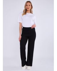 Gini London - Zwarte Broek Met Elastische Taille En Uitlopende Pijpen - Lyst