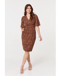 Izabel London - Printed Ruched Faux Wrap Knee Length Dress - Lyst