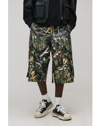 BoohooMAN - Baggy Fit Longline Printed Camo Pu Jorts - Lyst