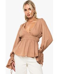Boohoo - Tie Cuff Peplum Blouse - Lyst