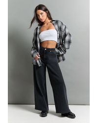 Boohoo - The Petite Mid Waist Wide Leg Jean - Lyst