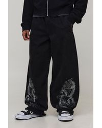 BoohooMAN - Dragon Embroidered Elasticated Waist Super Baggy Fit Jeans - Lyst